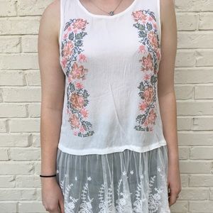 White lace shirt with flower embroidery.